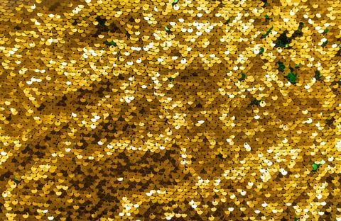 Colorful sequins sparkling background. Texture of sequins. Stock Photos