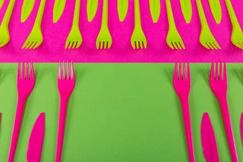 Colorful set of plastic table ware isolated on background Foto stock