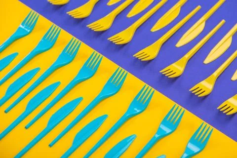 Colorful set of plastic table ware isolated on background 写真素材