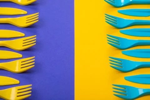 Colorful set of plastic table ware isolated on background 写真素材