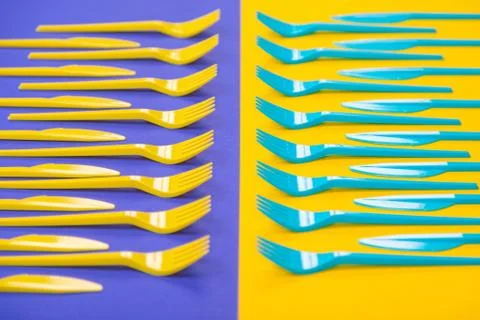 Colorful set of plastic table ware isolated on background Stock Photos