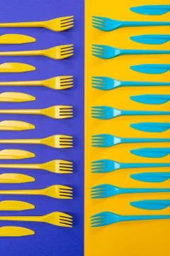 Colorful set of plastic table ware isolated on background Stock Photos