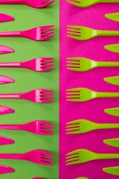 Colorful set of plastic table ware isolated on background Stock Photos