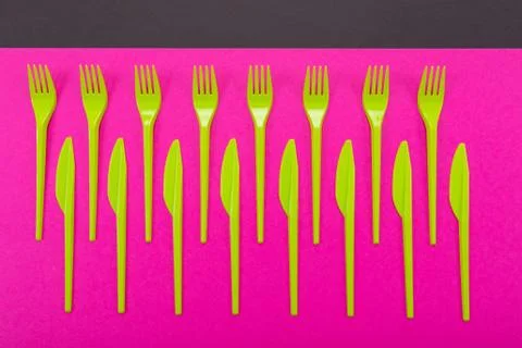 Colorful set of plastic table ware isolated on background Stock Photos