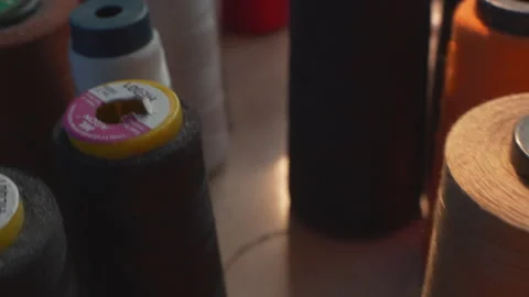 Colorful Sewing Thread and The Sun Shining Through Video stock 247416894