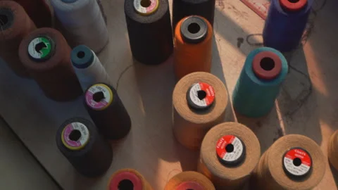 Colorful Sewing Thread and The Sun Shining Through Video stock 247416966
