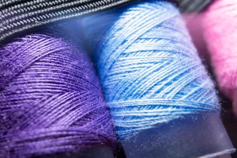 Colorful sewing thread spools in a row close up macro concept for textile Stock Photos