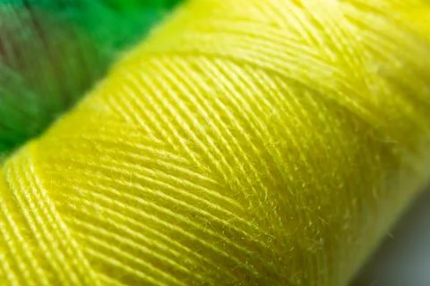 Colorful sewing thread spools in a row close up macro concept for textile Stock Photos