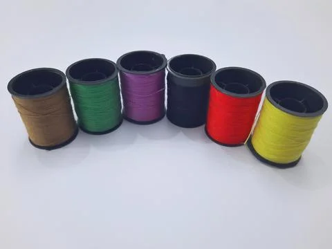 Colorful sewing thread spools on white background Stock Photos