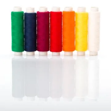 Colorful sewing threads Stock Photos