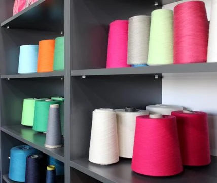 Colorful sewing threads wound on a thread spool. textile Stock Photos