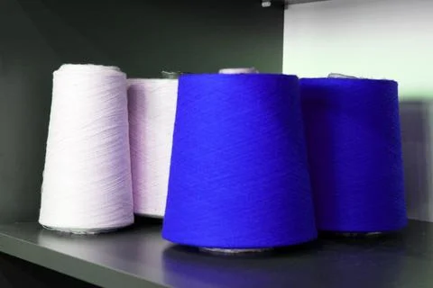 Colorful sewing threads wound on a thread spool. textile Stock Photos