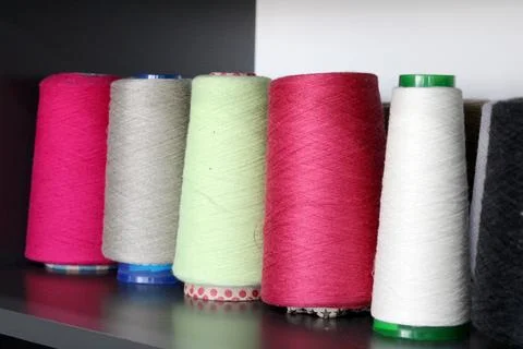 Colorful sewing threads wound on a thread spool. textile Stock Photos