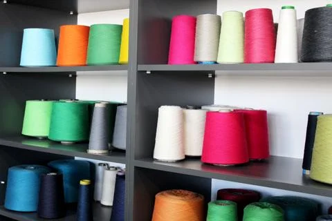Colorful sewing threads wound on a thread spool. textile Stock Photos