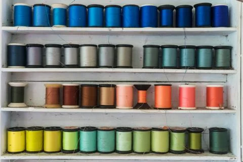 Colorful sewing thread/Sewing thread which is arranged on shelf. Stock Photos