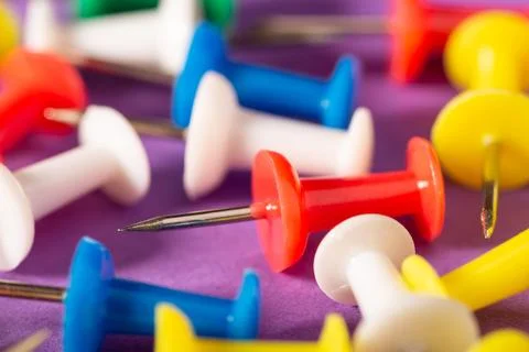 Colorful sharp tin-tacks Stock Photos