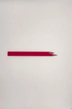 Colorful sharpened pencils are lined up on the table. Stock Photos