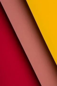 Colorful sheets of paper placed at an angle on a flat surface create a laye.. 스톡 사진