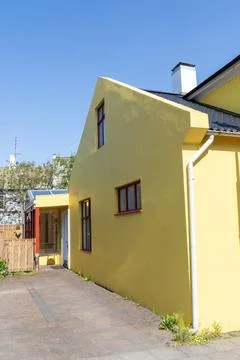 Colorful side of a yellow building in downtown Reykjavik Iceland Foto stock
