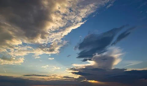 Colorful sky with clouds during sunset over horizon Stock Photos