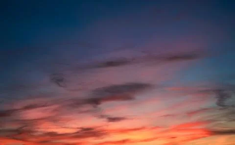 Colorful sky with clouds at sunset. Dramatic evening sky Stock Photos