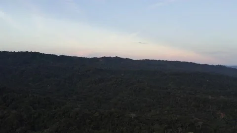 A colorful skyline with tints of blue, red, orange and yellow during sunset Stock Footage 155418331
