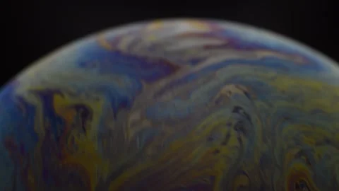Colorful soap bubble abstract patterns with colors rotating like a planet. Stock Footage 151457788