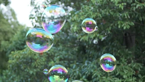 Colorful soap bubbles floating in the air Stock Footage 340280781