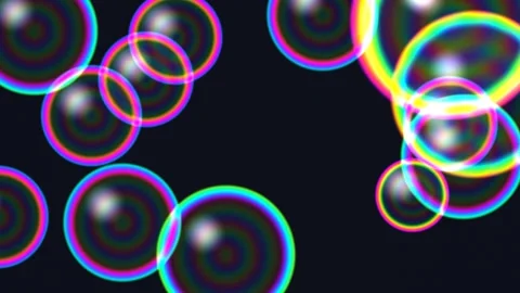 Colorful soap bubbles floating on dark background Stock Footage 339043537