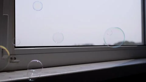 Colorful Soap Bubbles Floating by Window Stock Footage 316176305