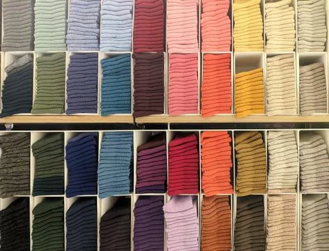 Colorful socks on a shelf Stock Photos