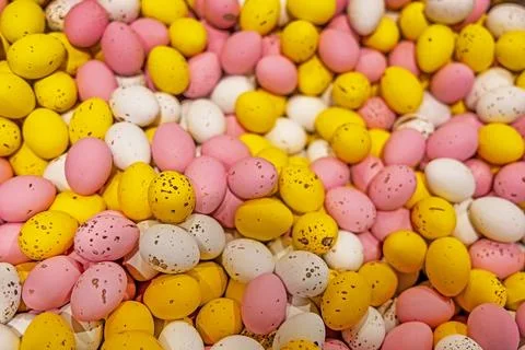 Colorful speckled candy Easter eggs background. Stock Photos