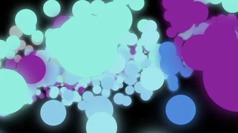 Colorful spheres in motion set against a dark background, producing a capti.. Stock Footage 328639719