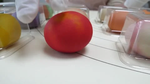 Colorful Spherical Macaron or Mochi Dessert on a White Tabletop Exhibition Stock Footage 345293455