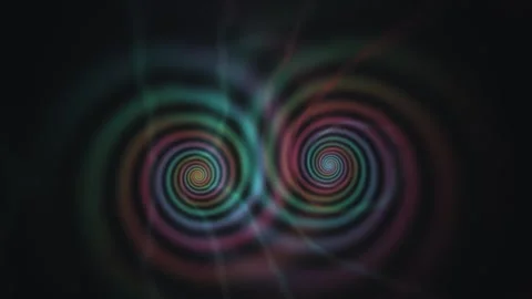 Colorful spirals create a hypnotic effect in a dark setting Stock Footage 338426023