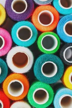 Colorful spools of sewing thread. Colored thread for sewing Stock Photos