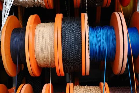 Colorful spools of thread and rope in a storage area Stock Photos