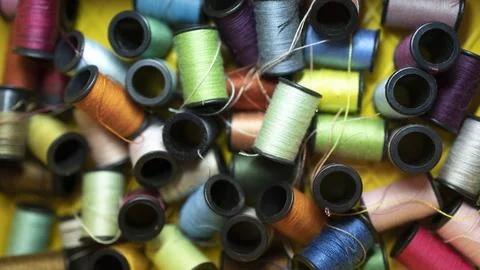 Colorful spools of thread prepared for sewing projects. Stock-Fotos