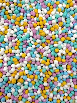 Colorful Sprinkles Background Pattern of Tiny Round Candies. Stock Photos