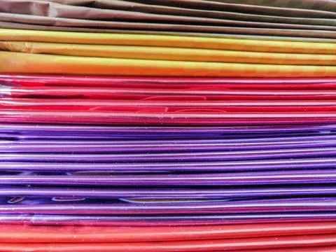 Colorful stack of reflective vibrant paper in a office from stationary store Stock Photos