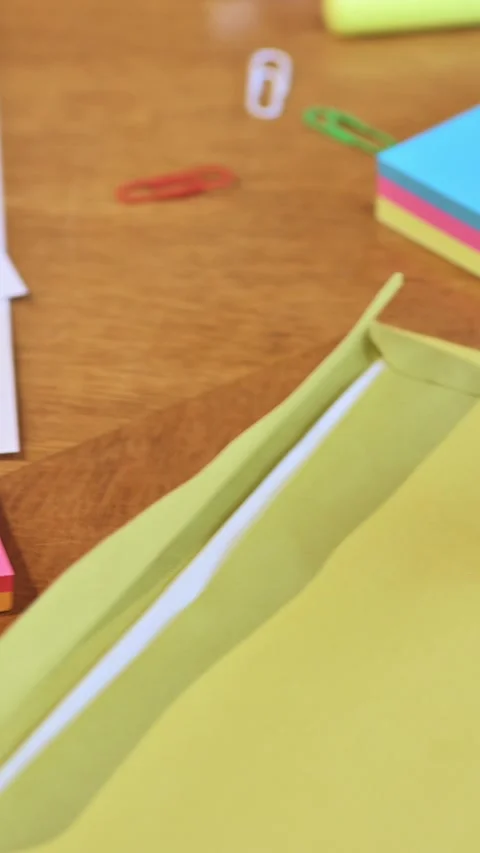 Colorful Sticky Notes and Blue Stapler on Wooden Desk. 動画素材 336409233