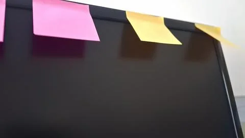 Colorful sticky notes on a computer screen. Office reminders attached to a Stock Photos