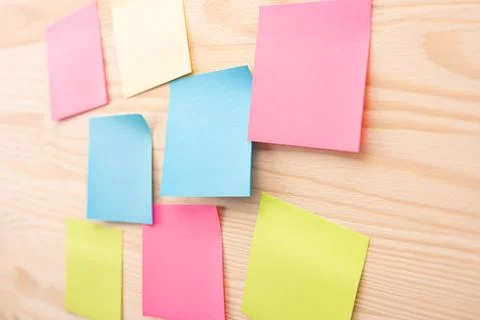 Colorful sticky notes with things to do on office board. Using task control o Stock Photos