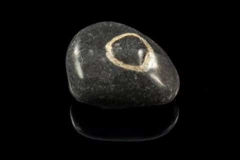 Colorful stone with different designs and colors and black background Stock Photos