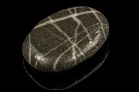 Colorful stone with different designs and colors and black background Stock Photos