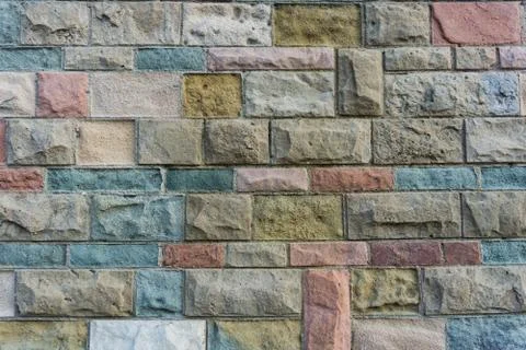 Colorful stones wall texture. Rectangular stones. Color background. Stock Photos
