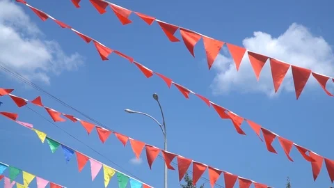 Colorful string pennant triangle flags blowing in the wind. Stock Footage 93962041