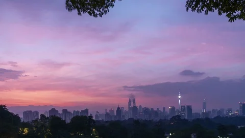 Colorful sunrise scenery with moving clouds over Kuala Lumpur city landmark Stock Footage 99784953