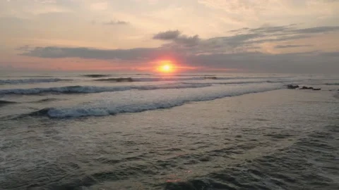 Colorful sunset and waves Stock Footage 166561688