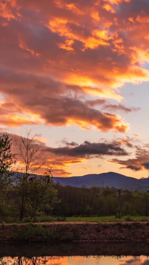 Colorful sunset in the cloudy sky time lapse Stock Footage 293157552